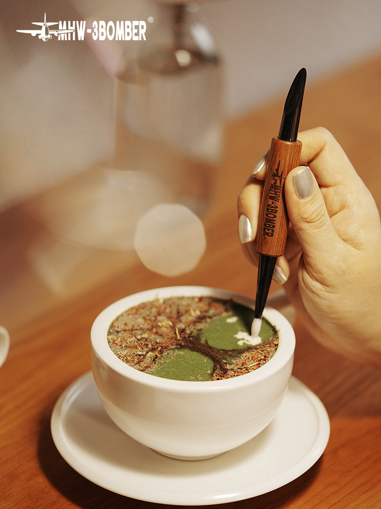 MHW-3BOMBER CN5400R black-tipped rosewood latte art pen etching a drink surface; cup and drink separate