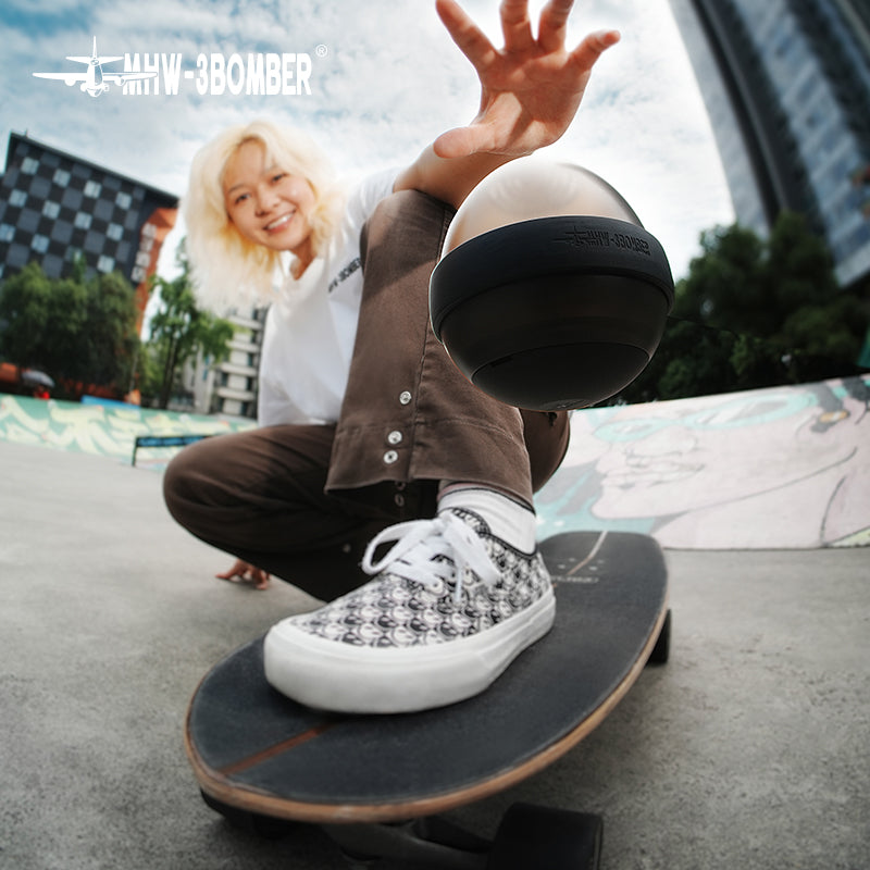 MHW-3BOMBER FC6687B black Eggonaut dripper held closed, viewed from below; skateboard and clothing are scene props