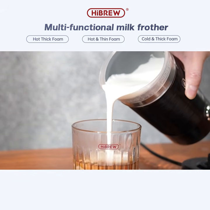 Pouring foam from the HiBREW M1A black frother into a glass of coffee