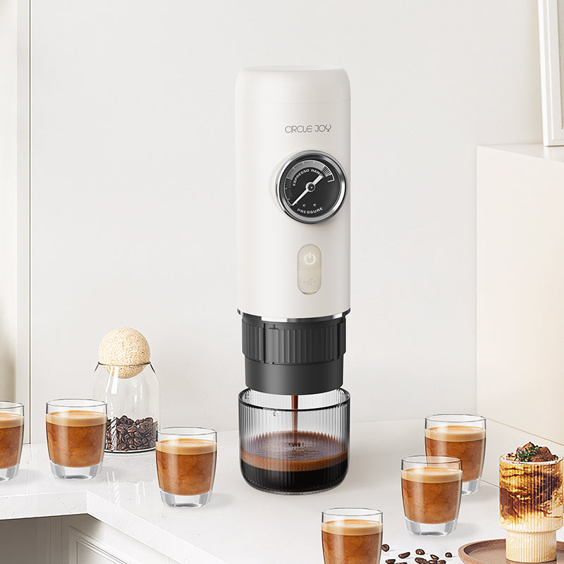 Circle Joy portable coffee machine and styled coffee glasses arranged in a bright supplier scene