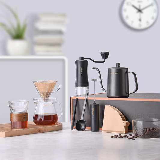 Circle Joy grinder, kettle, dripper, server and coffee tools arranged on a counter