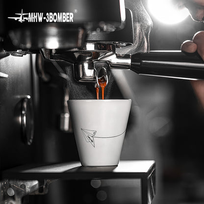 MHW-3BOMBER Winter Cup 120 ml, white cup under espresso machine