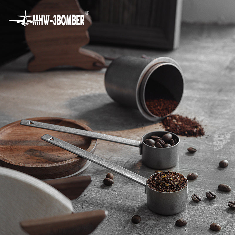 MHW-3BOMBER MS5438 silver-spot spoon beside a coffee canister with coffee beans