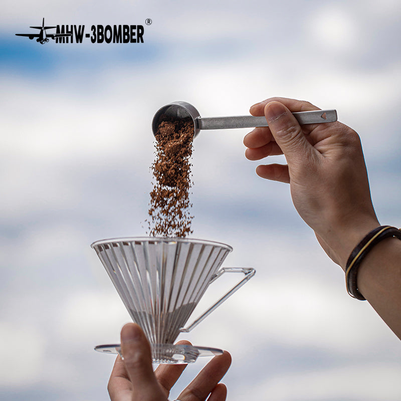 MHW-3BOMBER MS5438 silver-spot spoon pouring coffee over a dripper