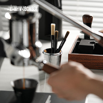 MHW-3BOMBER B5525B black ABS pen brush in a coffee bar setting