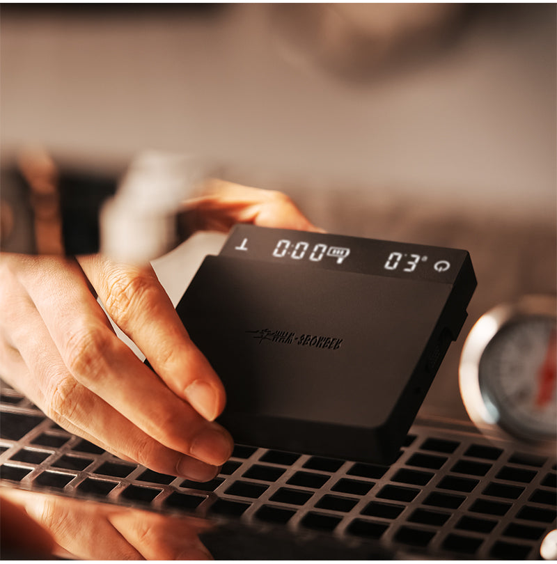 MHW-3BOMBER Cube Coffee Scale 3.0 Micro shown in hand to illustrate its compact size (SKU ES5788B).