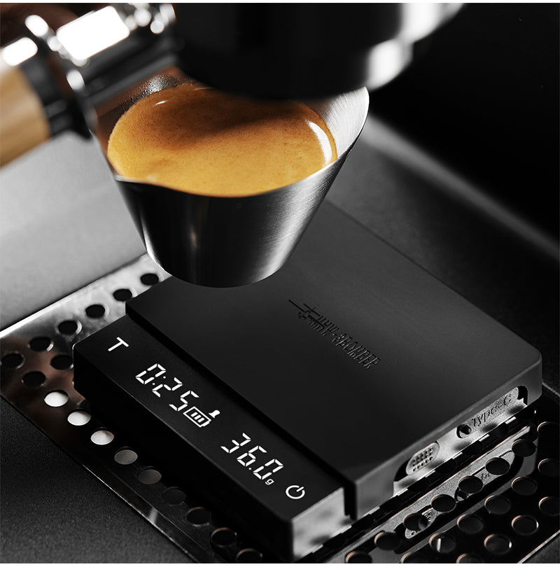 Espresso being weighed on the MHW-3BOMBER Cube Coffee Scale 3.0 Micro (SKU ES5788B).