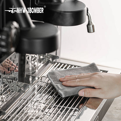 Grey towel from the MHW-3BOMBER CT5322 four-piece blue and grey set wiping a drip tray; espresso machine is not included