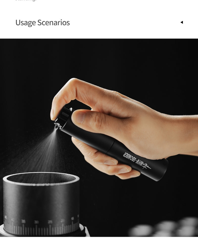 MHW-3BOMBER SB6559 black RDT spray bottle held over a grinder; grinder is a demonstration prop and is not included