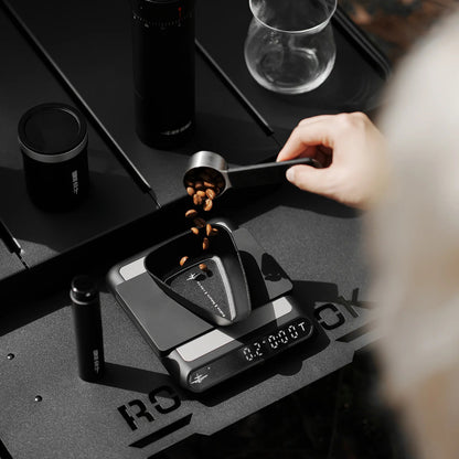 MHW-3BOMBER SB6559 black RDT bottle beside a bean dosing tray; other equipment and beans are demonstration props, not included