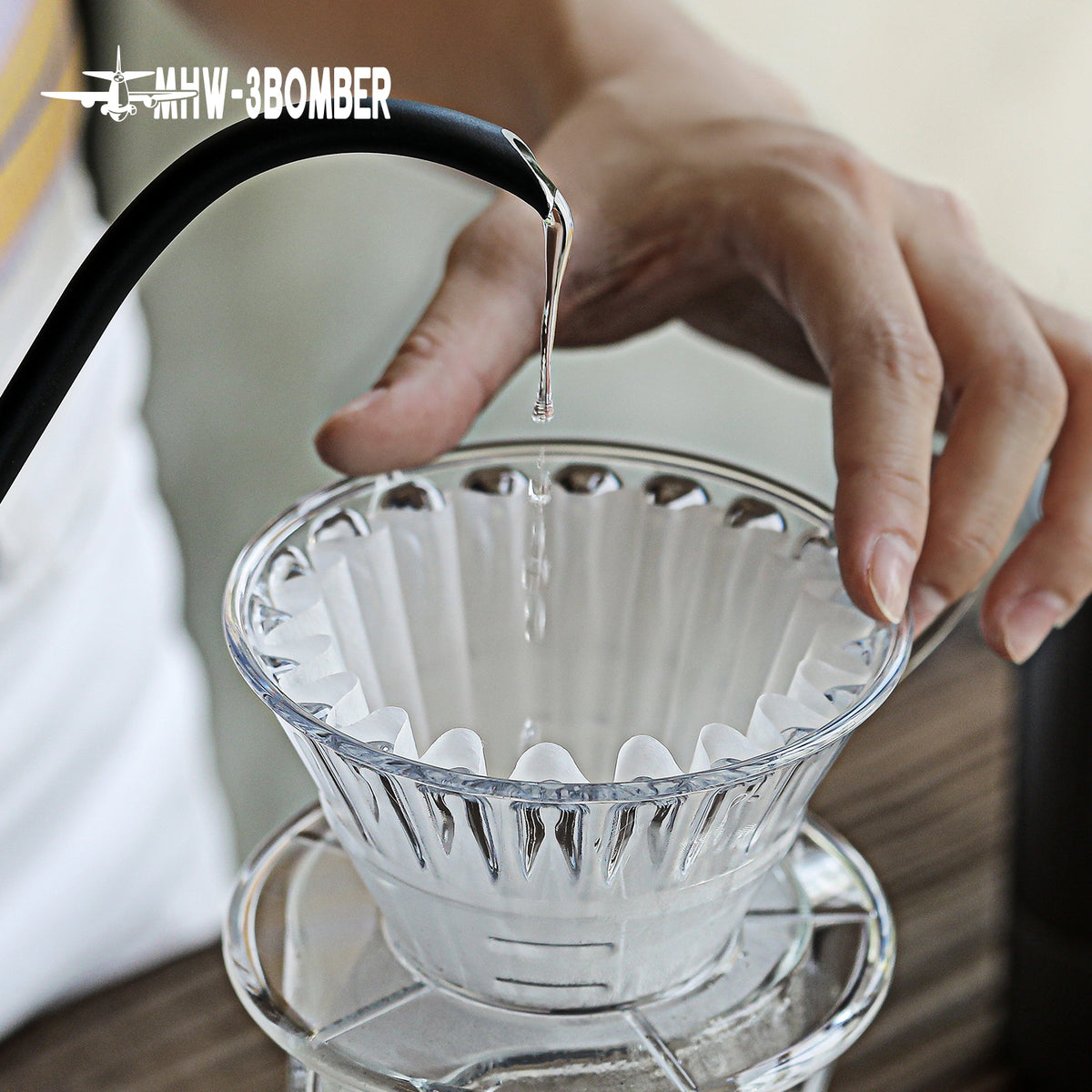 MHW-3BOMBER FP5457 155 cake-shaped filter paper in a glass dripper during pre-wetting