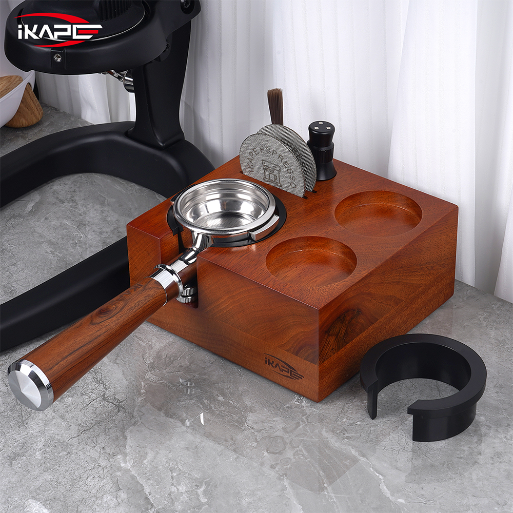 IKAPE seven-in-one walnut tamping station with a portafilter on a coffee counter; coffee tools shown are sold separately.