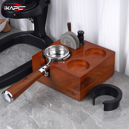 IKAPE seven-in-one walnut tamping station with a portafilter on a coffee counter; coffee tools shown are sold separately.