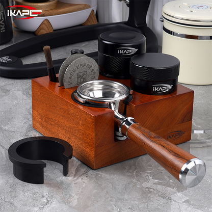 IKAPE walnut tamping station organizing a portafilter, tamper and distribution tools; coffee tools are sold separately.