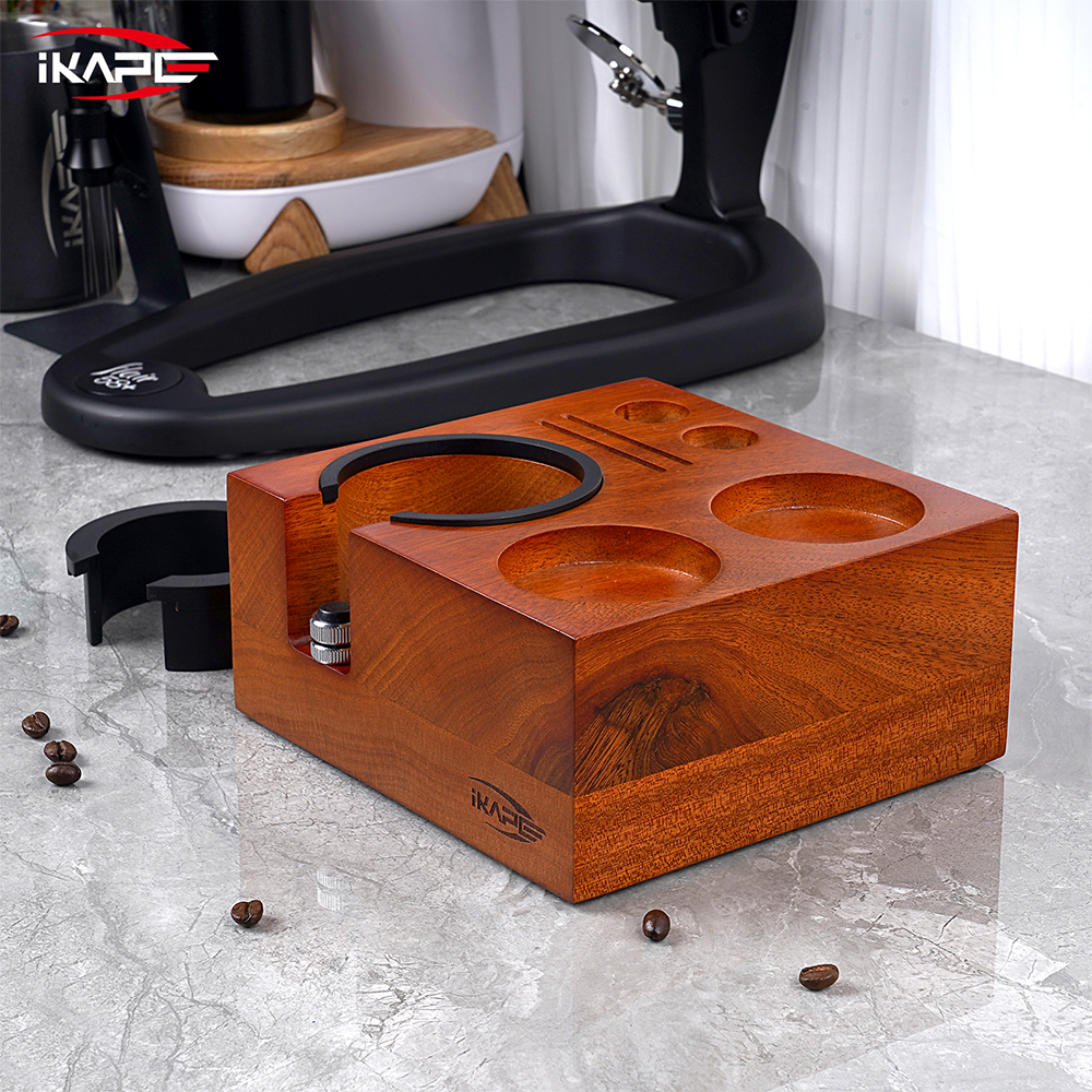 IKAPE seven-in-one walnut tamping station on a coffee counter, with its adjustable handle support.