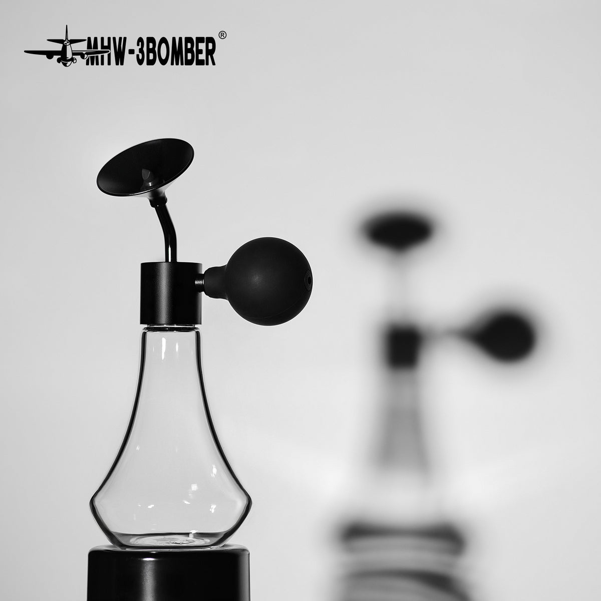 AB5677 Coffee Aroma Bottle photographed on a pedestal with a second bottle in the background