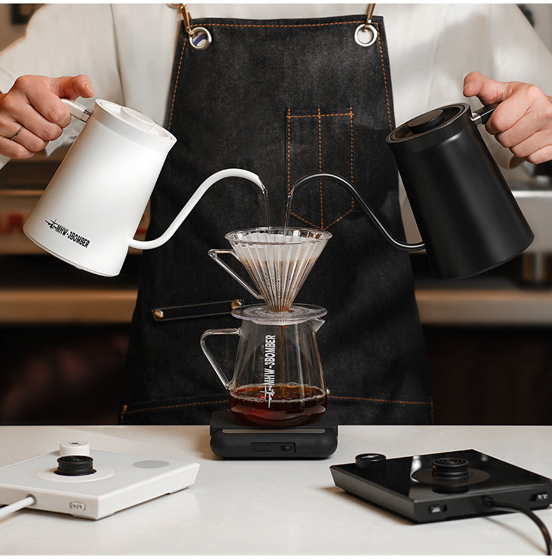Black and White Assassin kettles pouring side by side; one selected colour supplied