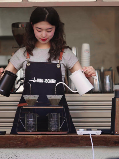White and Black Assassin kettles used with two separate pour-over drippers; brewing accessories sold separately