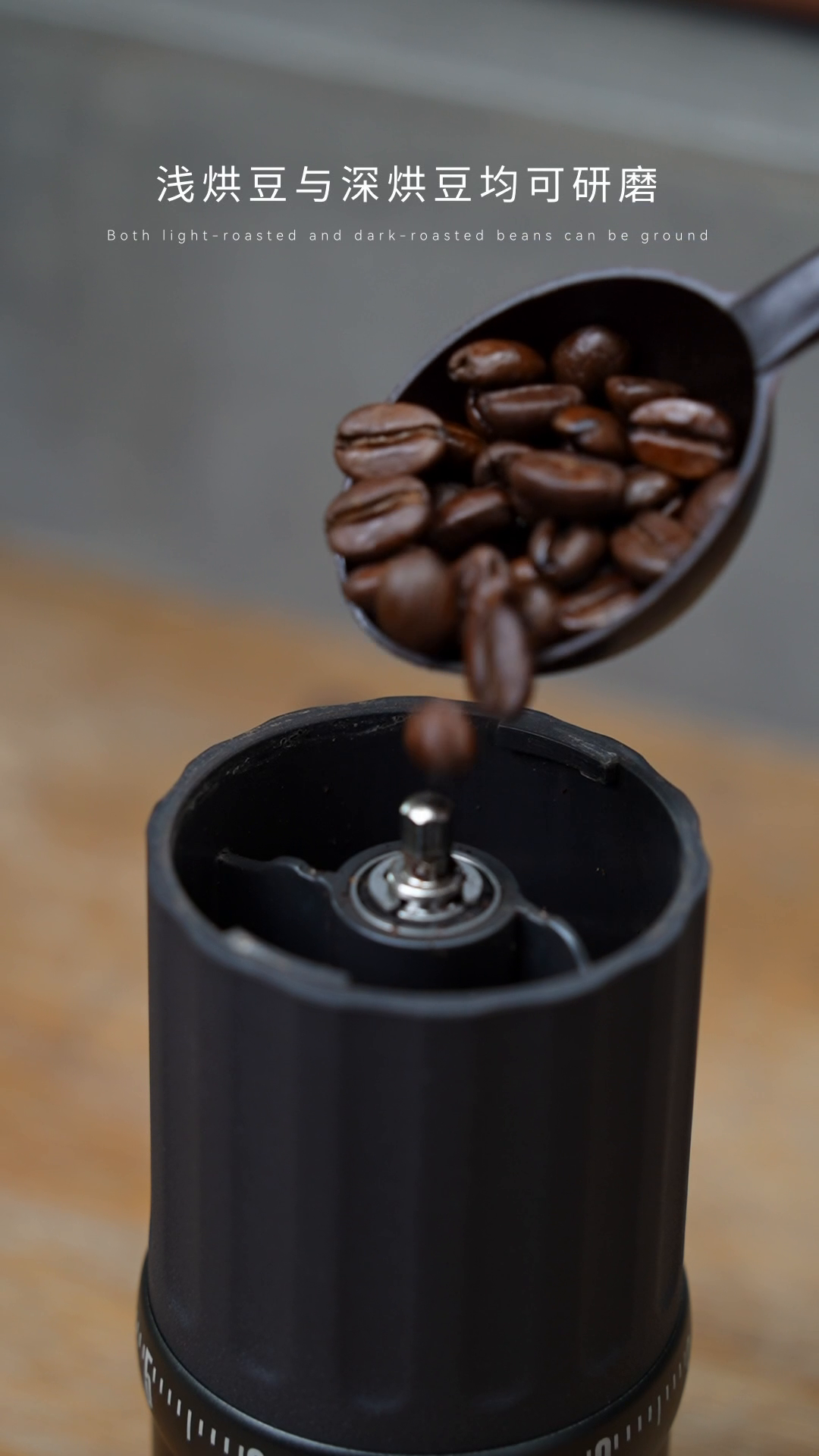 Adding coffee beans to the CERA+ CGE03 Space Grey grinder hopper