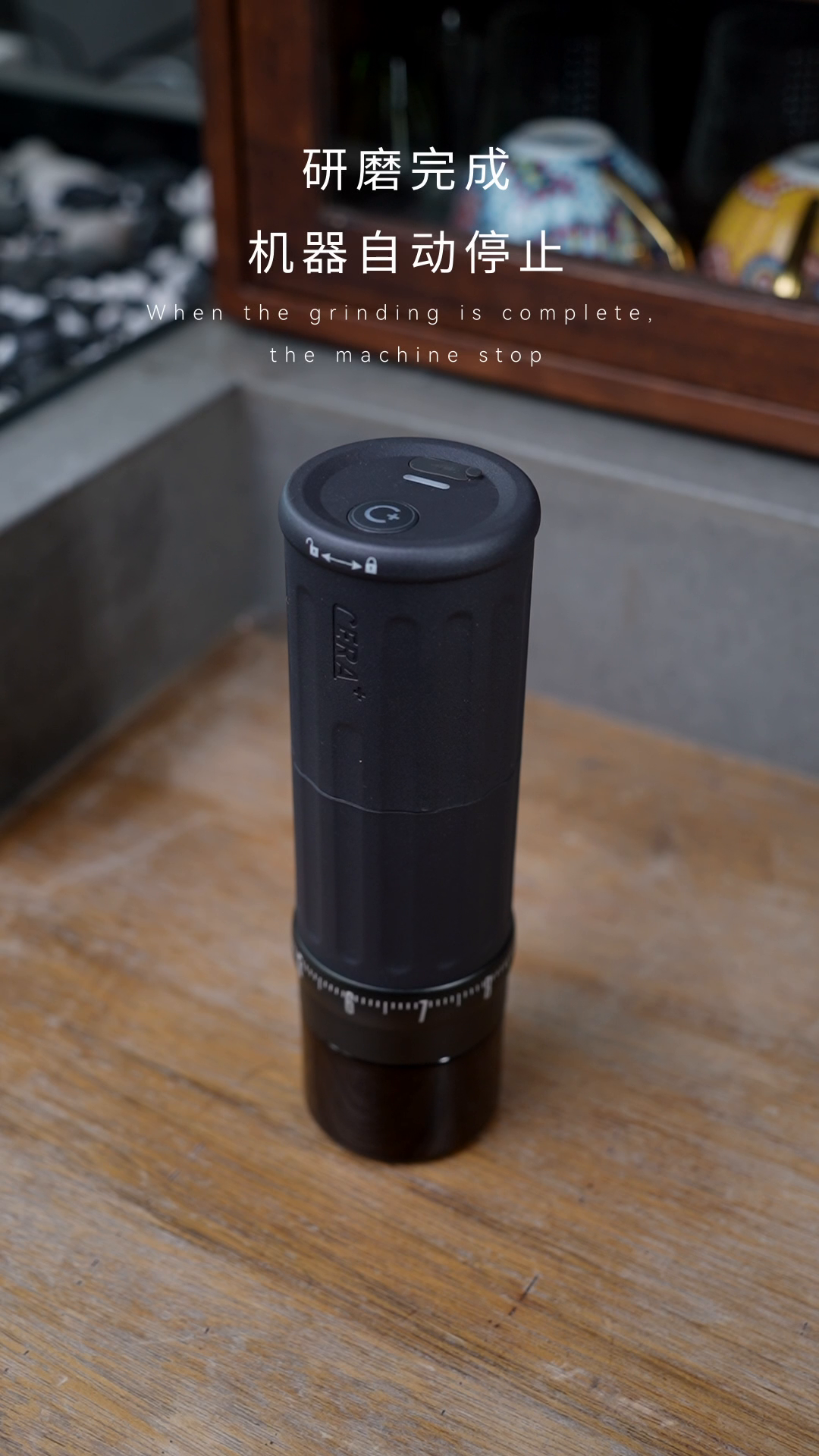 CERA+ CGE03 Space Grey electric grinder standing upright with its grounds container fitted