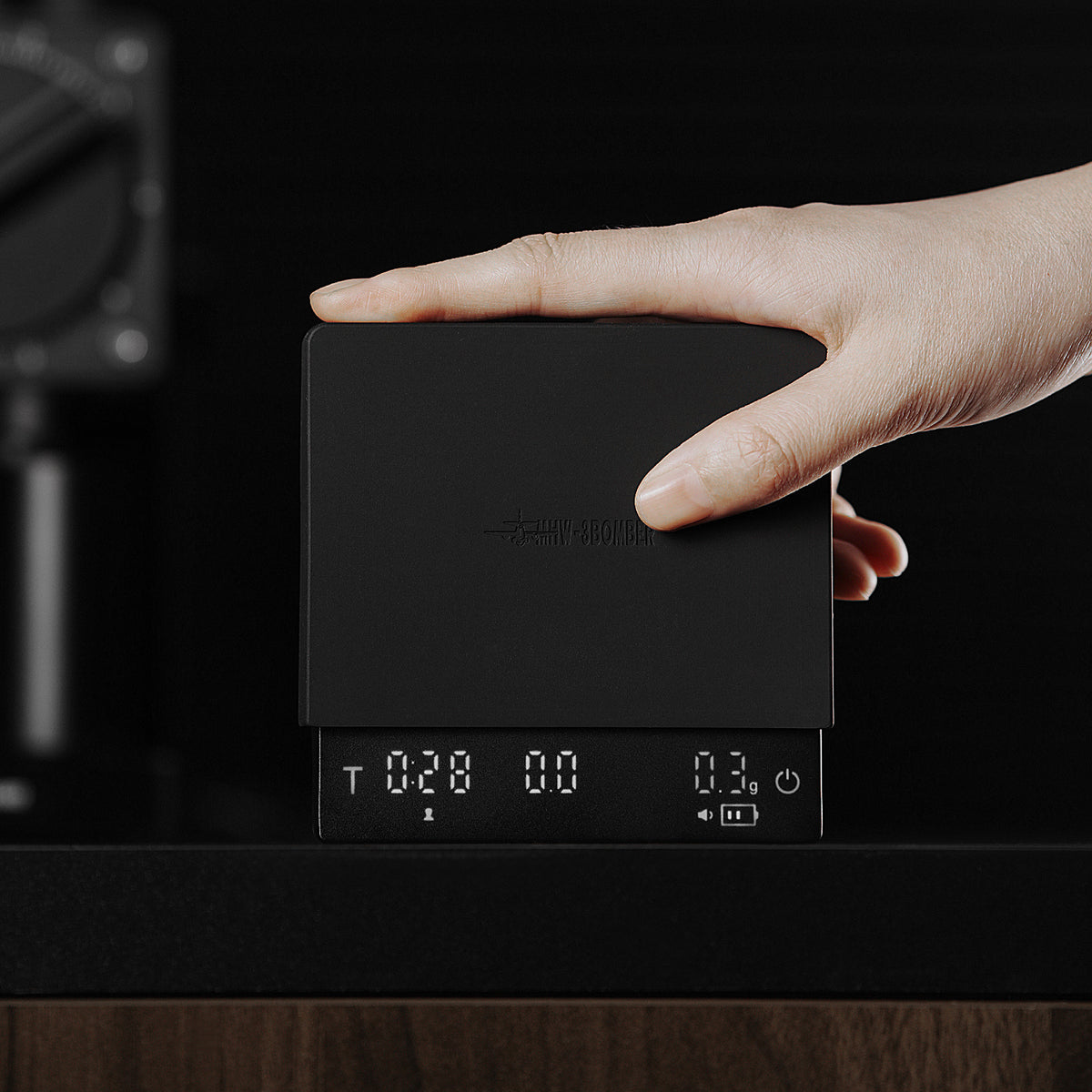 MHW-3BOMBER Cube Coffee Scale 3.0 Mini Pro, black — ES6029B — upright handheld; brewing accessories are scene props
