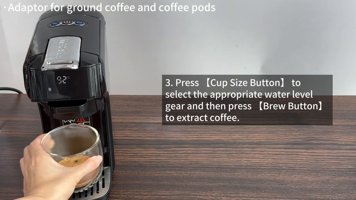 HiBREW H1B Black — ground-coffee preparation into a handled cup