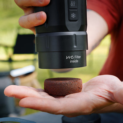HiBREW H4C bottomless adapter and coffee puck after brewing