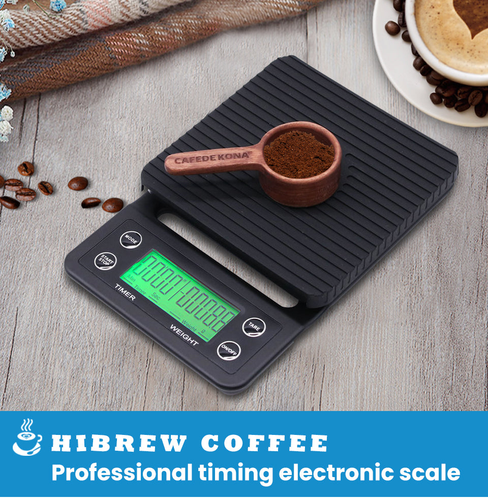 HiBREW 3000g Timer Coffee Scale — coffee scoop on the ribbed mat. Scene props are not included unless quoted.