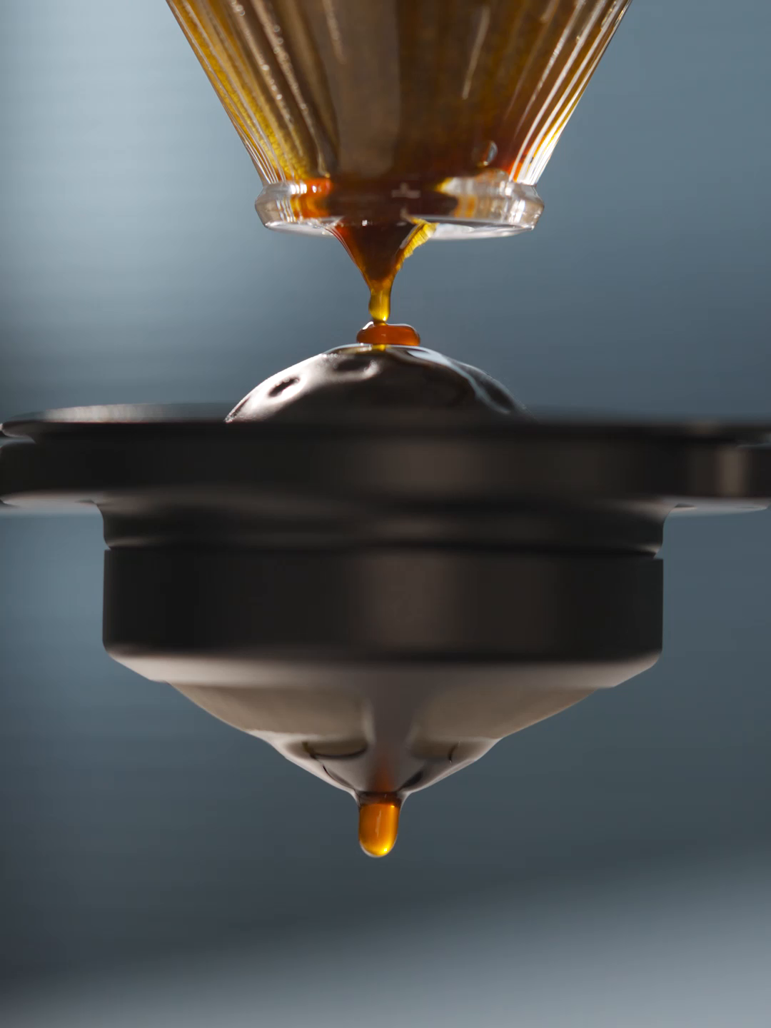 MHW-3BOMBER IH6658L 42 mm chilling ball beneath a pour-over coffee stream; brewing equipment is separate