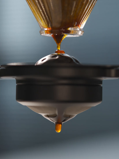 MHW-3BOMBER IH6658L 42 mm chilling ball beneath a pour-over coffee stream; brewing equipment is separate