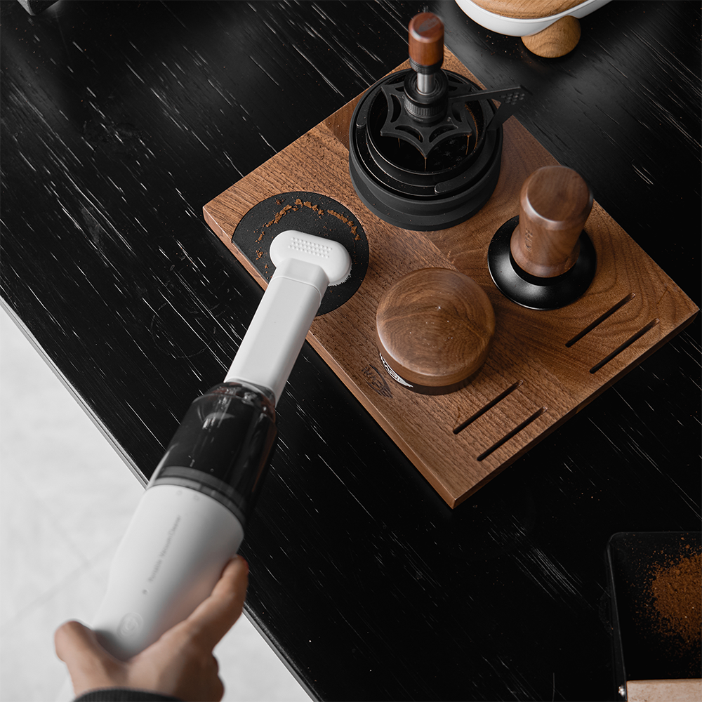 IKAPE White handheld vacuum cleaning a tamping station