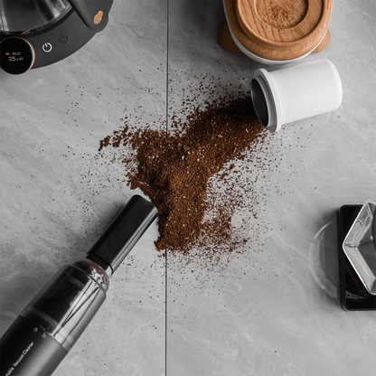 IKAPE Black vacuum cleaning spilled coffee grounds