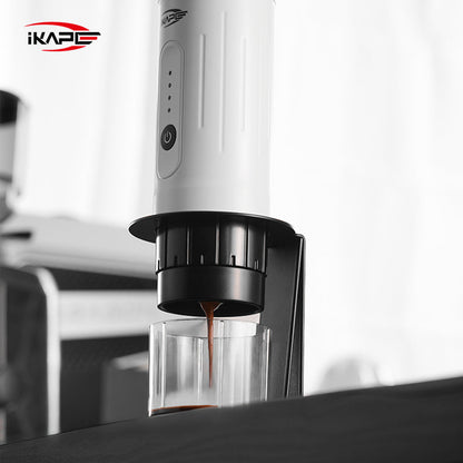 IKAPE black standard portable coffee maker stand in use; coffee maker and cup are presentation props, photograph 10