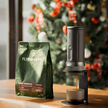 IKAPE black standard portable coffee maker stand in use; coffee maker and cup are presentation props, photograph 3