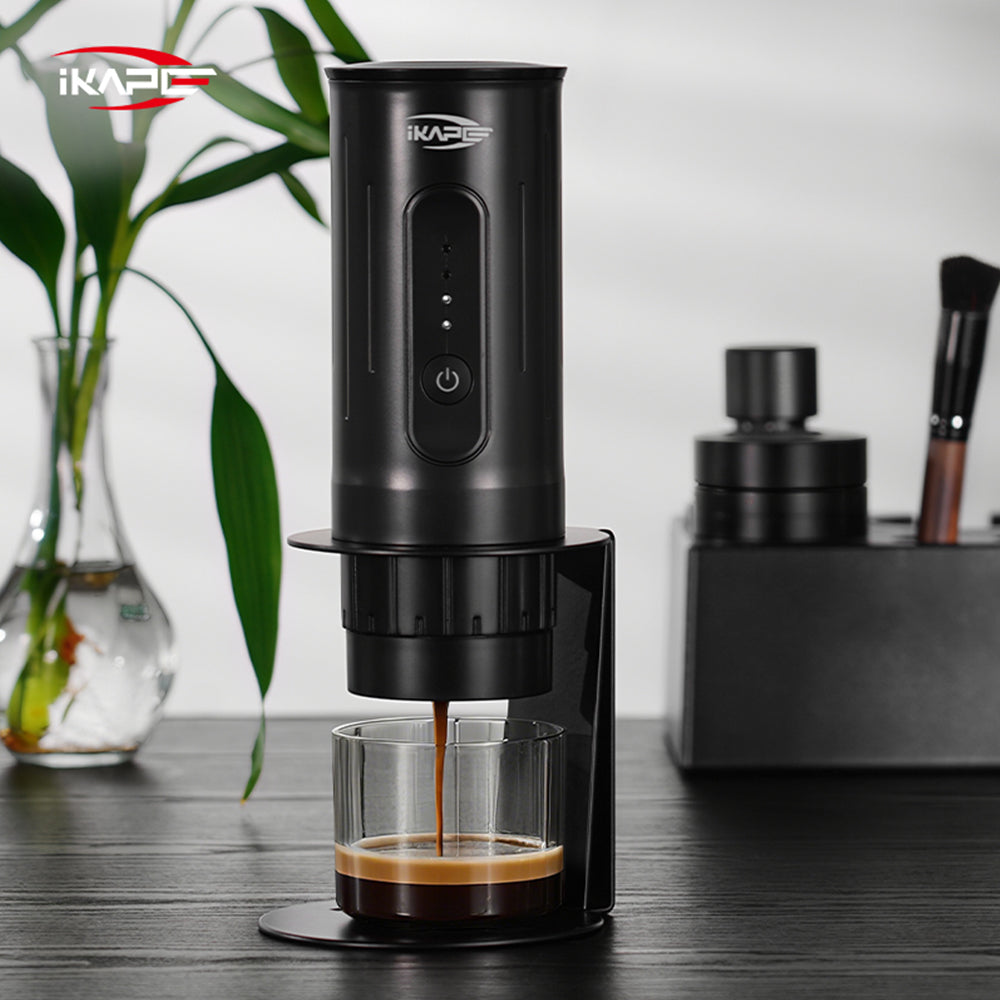 IKAPE black standard portable coffee maker stand in use; coffee maker and cup are presentation props, photograph 7