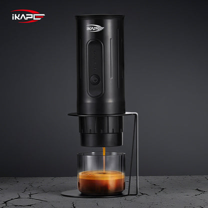 IKAPE black standard portable coffee maker stand in use; coffee maker and cup are presentation props, photograph 8