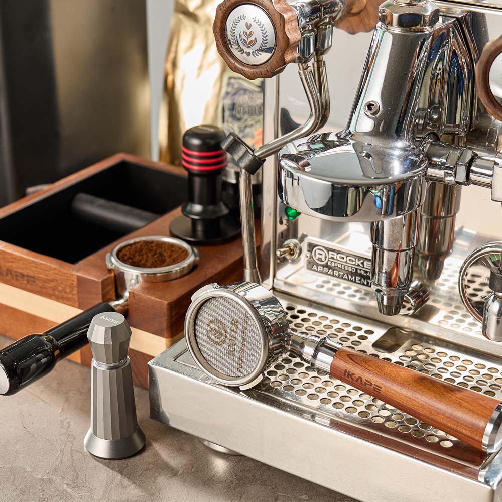IKAPE V1 organizer beside an espresso machine