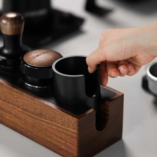 MHW-3BOMBER Walnut CH6622 portafilter station showing removable slot insert; cup-shaped insert is part of the station, other tools are props, exact fit requires confirmation