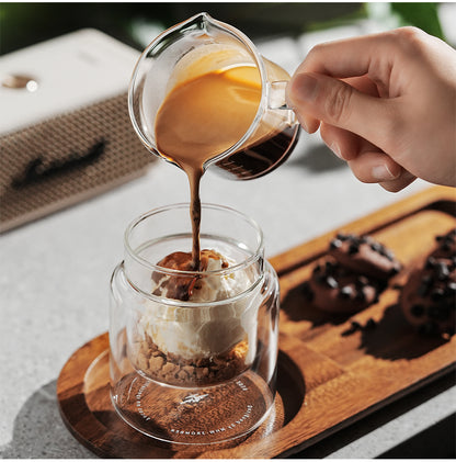 MHW-3BOMBER Clear H-shaped 160 ml DW glass cup receiving coffee on a tray; other items are props