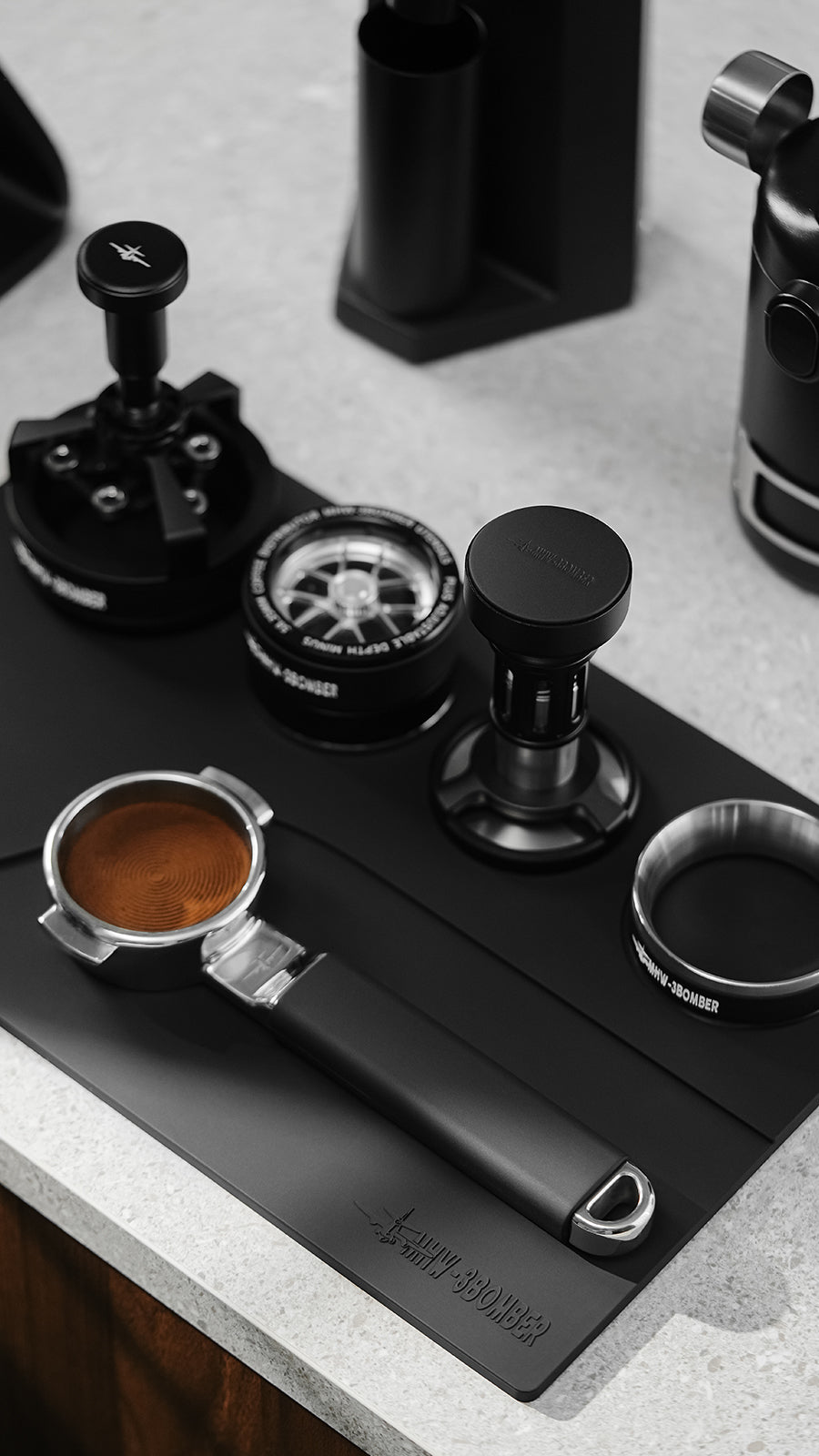 MHW-3BOMBER Black Yu mat recessed tool area close view; coffee tools shown for reference