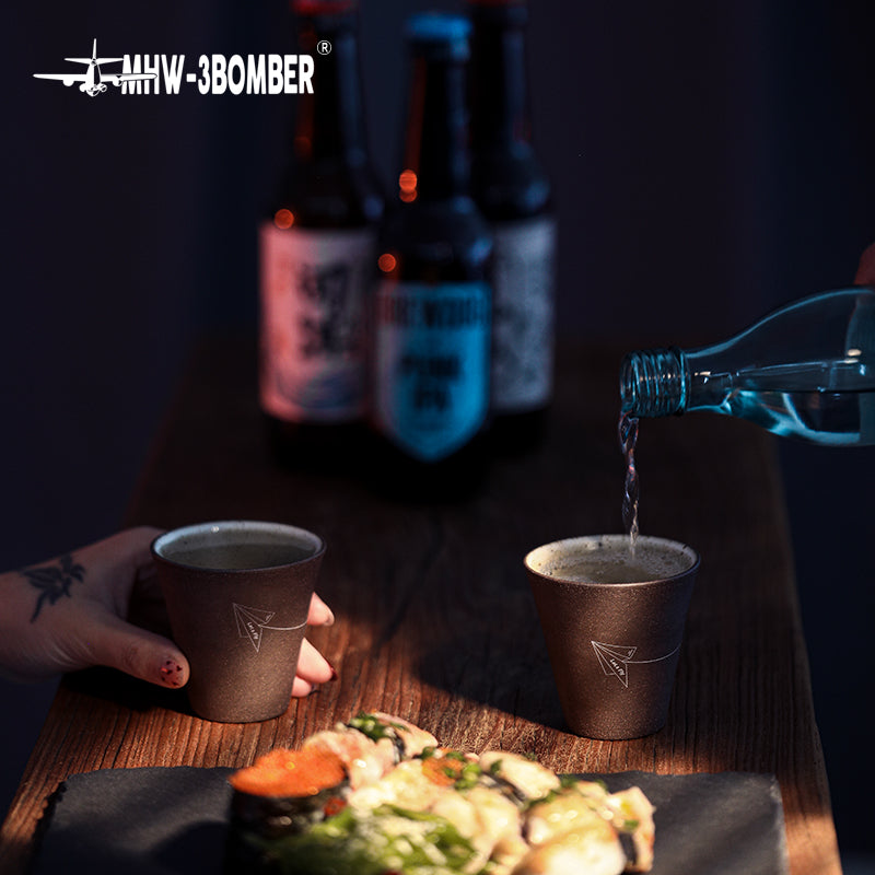 MHW-3BOMBER Winter Cup C5091G Starry Grey cups during a pouring scene; beverages and table items are photographic props