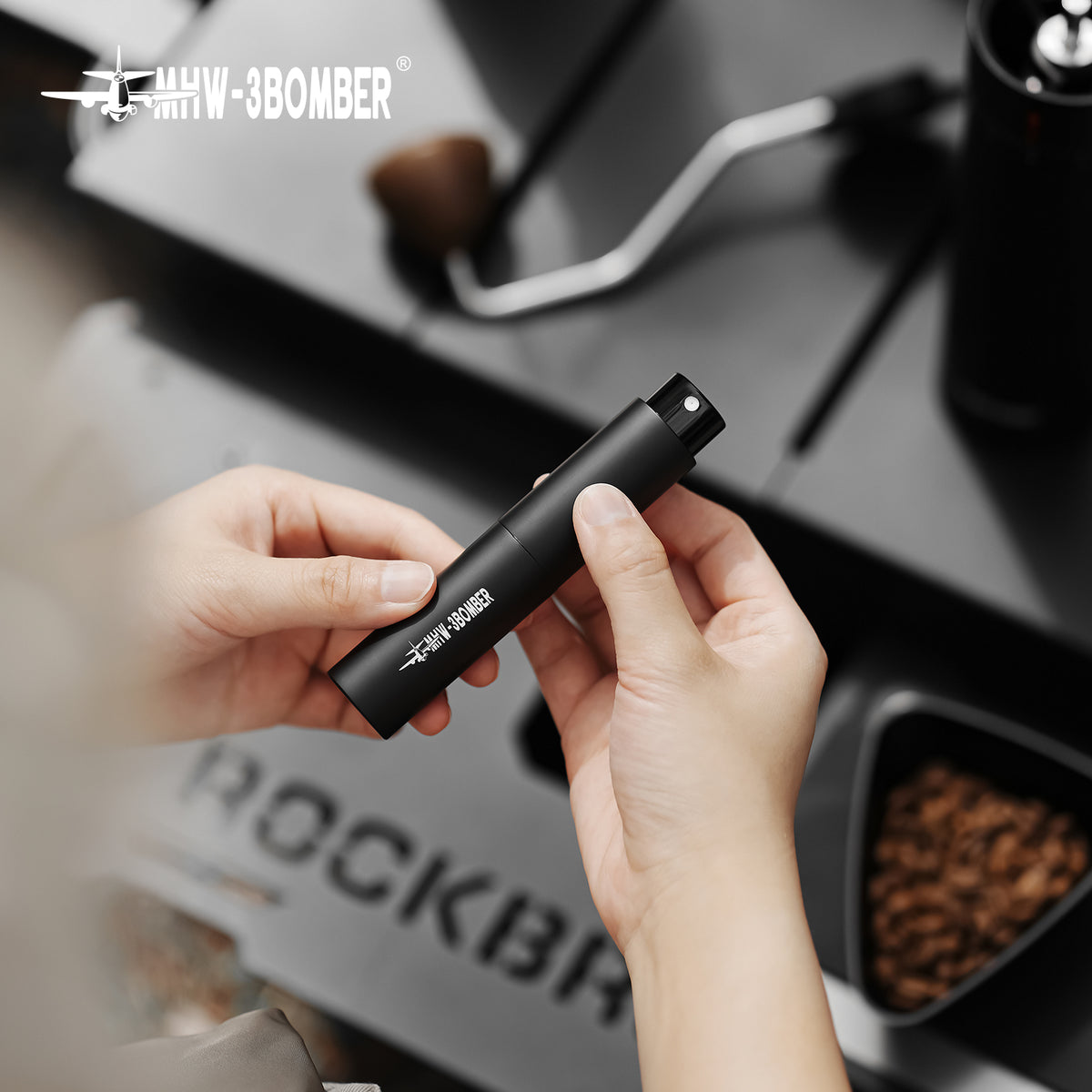 SB6559 black spray bottle held in hand
