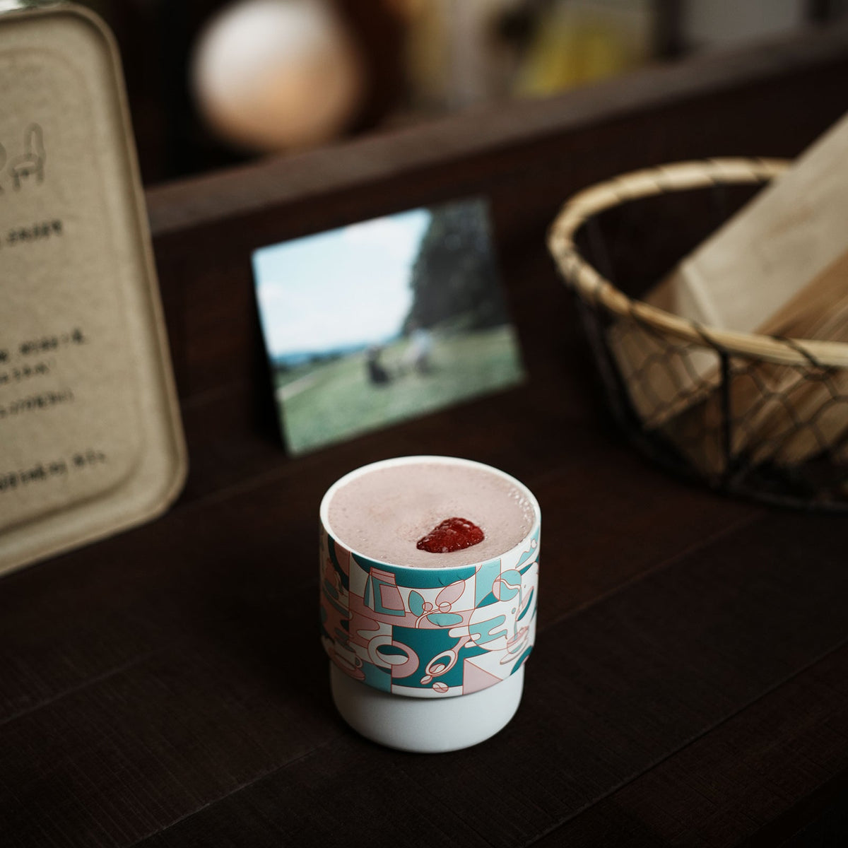 MHW-3BOMBER DW6908PG Pink Green Coffee Story White Swirl Cup on a bookshelf; display props not included