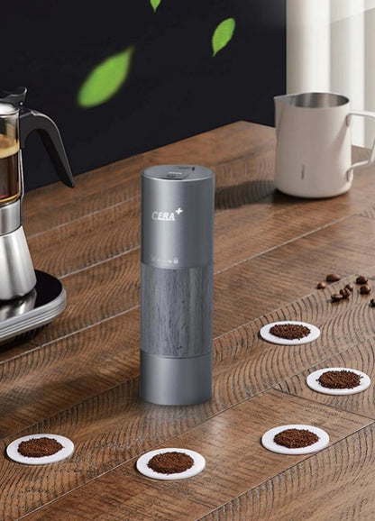 Grey CERA+ CGE01 internal-adjustment electric grinder on a coffee counter.