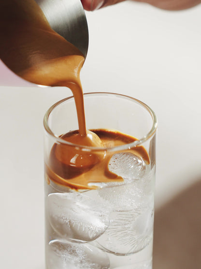 MHW-3BOMBER G5140 satin single-spout measuring cup pouring espresso over ice