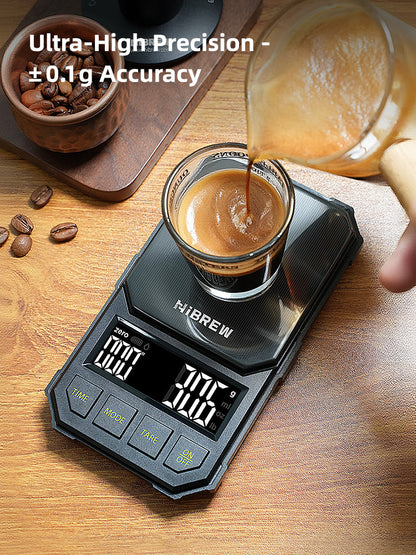 HiBREW black 1000g coffee scale — Black four-button scale during pouring into an espresso cup; cup and pitcher excluded.
