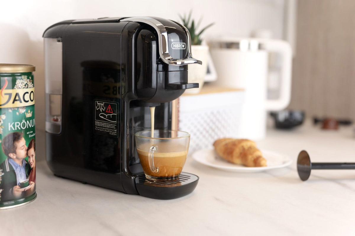 HiBREW H2B Black brewing coffee into a glass; glass and food are not included