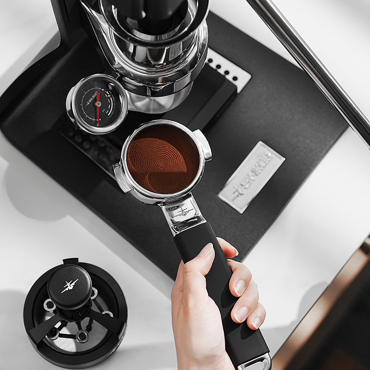 MHW-3BOMBER T5879 Yu one-piece bottomless portafilter with prepared coffee grounds; demonstration equipment not included