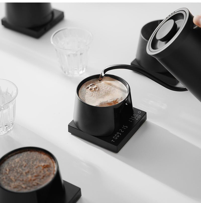 MHW-3BOMBER black cupping bowl on a scale with a pouring kettle