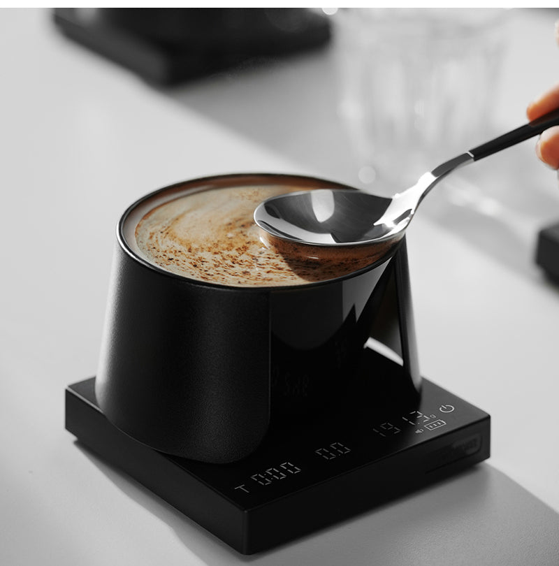MHW-3BOMBER black cupping bowl with a spoon in a tasting scene